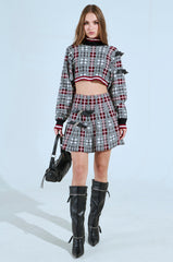 ALL EYES ON ME BUCKLE DETAIL KNIT MINI SKIRT IN RED