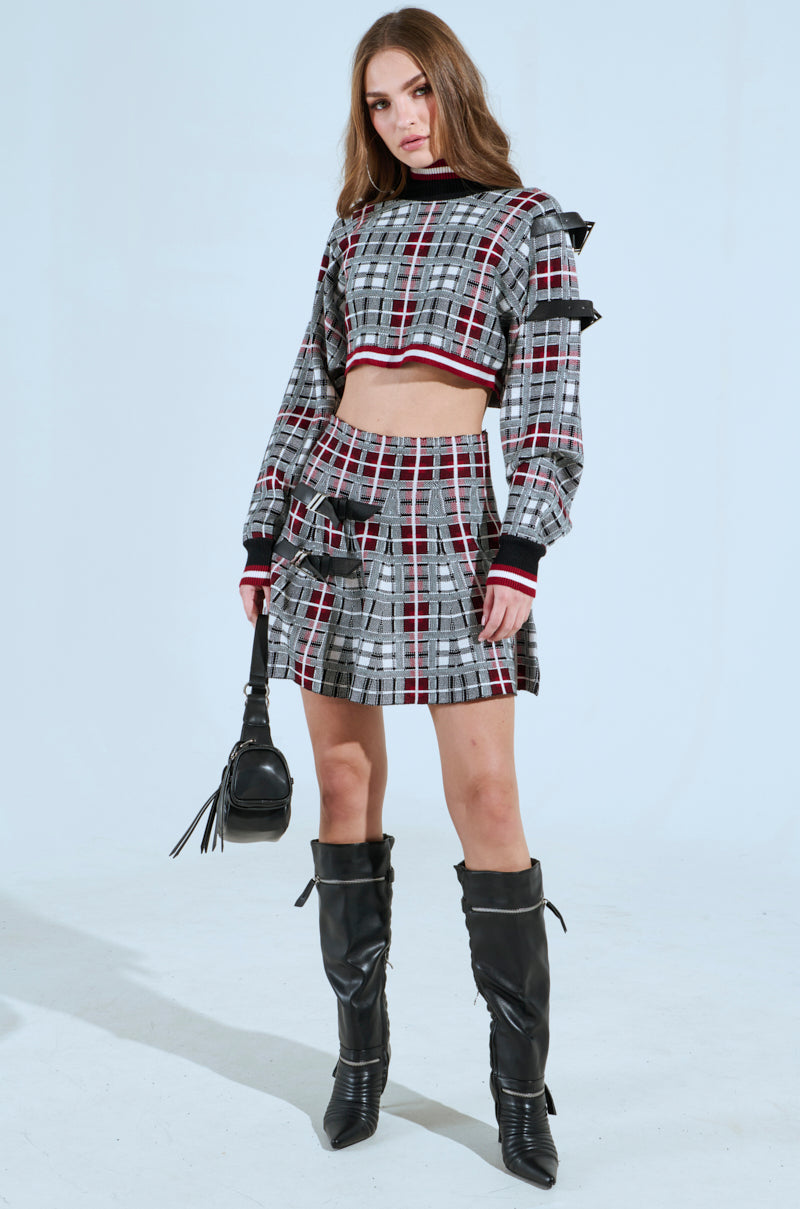 ALL EYES ON ME BUCKLE DETAIL KNIT MINI SKIRT IN RED